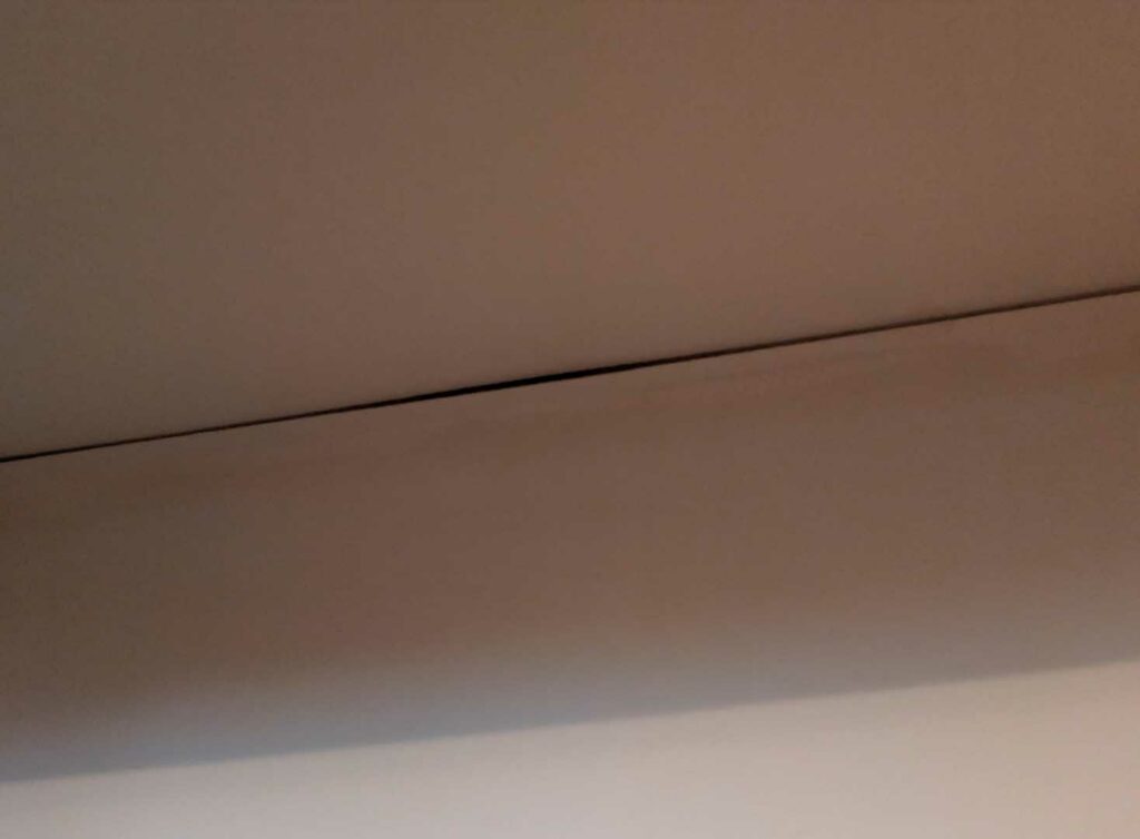 Cracking between wall and ceiling