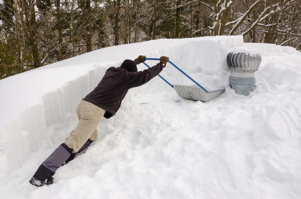 shoveling snow off roof to prevent ice dam 