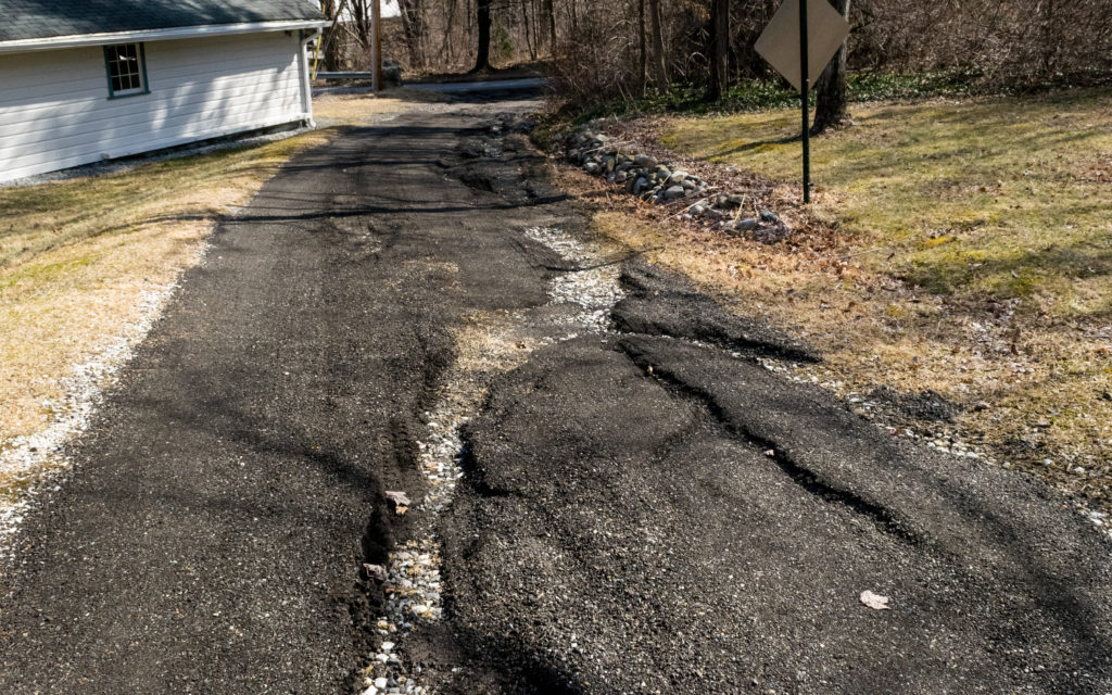 Cracked pavement from frost heave.