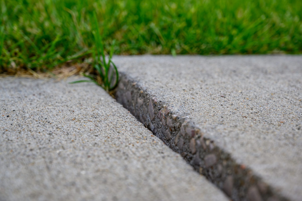 Uneven sidewalk due to frost heave.