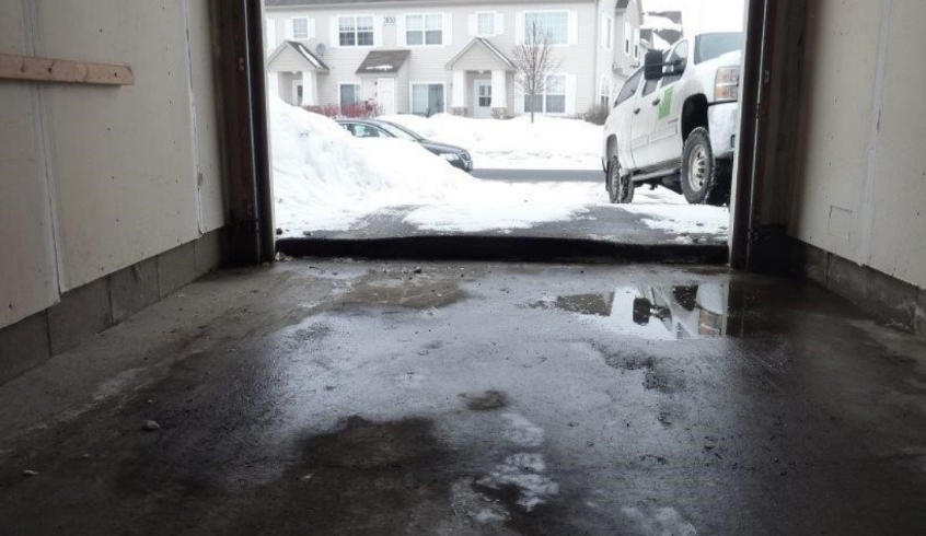Frost heave damaging the garage apron.