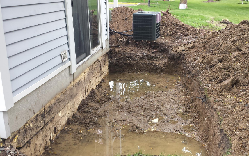 Water discovered around the foundation of a townhome.