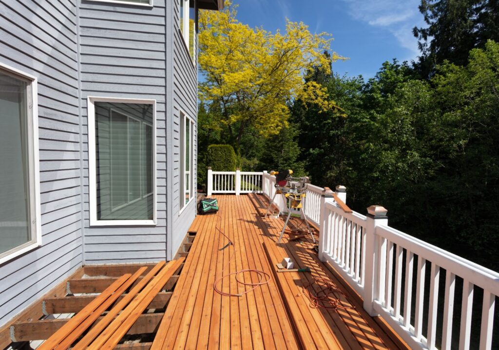 General guidelines on how to install a deck ledger board on houses with vinyl, wood, concrete, brick or stucco siding